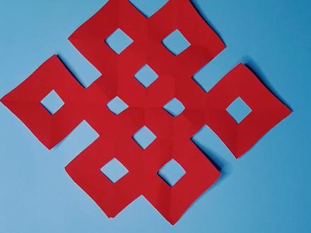 两刀就可以剪出吉祥盘长结,一起动手试试吧!#海豚知道 #剪纸 #茌平剪纸传承人田田 @DOU+小助手