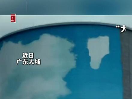网友路过发电站,看到工人正在为冷却塔画画。“大烟囱成为了一道
