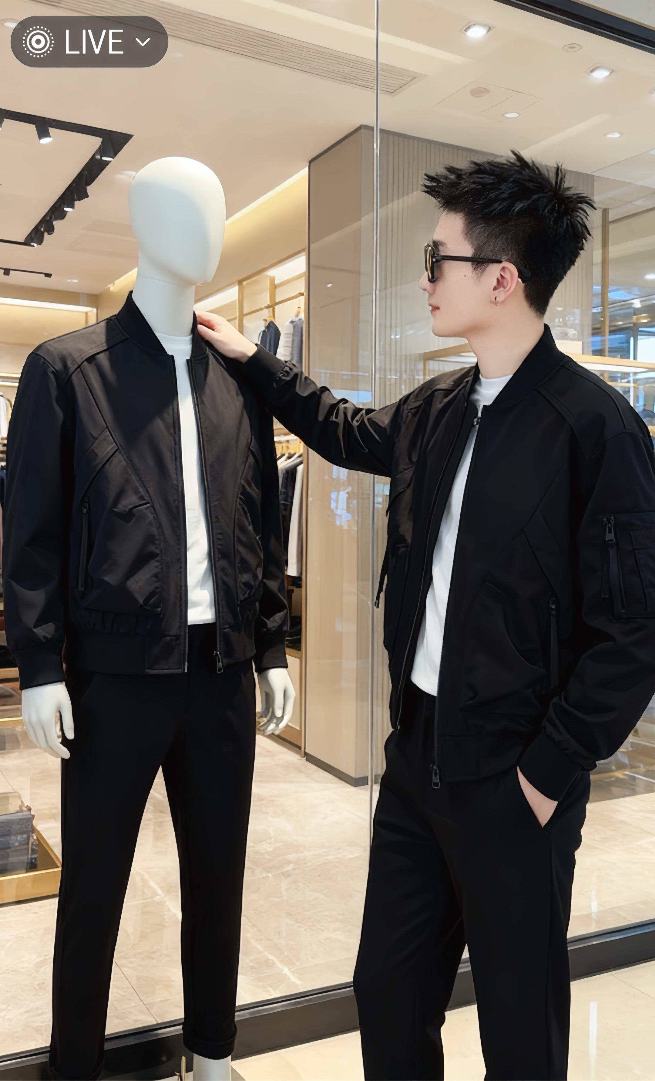 林默靠在高级男装店的胡桃木展示台上,指尖划过手机屏幕,目光却漫不经心地扫过镜中自己的黑色夹克。金属拉链泛着冷光,臂袋的设计暗藏玄机,像他此刻的身份——游走在时尚与机密之间的买手。 身后的人体模特穿着同款套装,像个沉默的替身。他忽然想起半小时前,接头人用“这款夹克的暗袋能装下最新的存储卡”作为暗号。 店员恭敬地递来一杯冷萃,林默接过时,瞥见对方腕表下的微章——那是情报圈特有的标记。他嘴角勾起一抹极淡的笑,指尖在手机上敲出一行字:“确认,猎物已入‘试衣间’。” 此刻,顶级面料的挺括感与秘密任务的紧张感,在他身上糅合成一种致命的高级感。#潮酷穿搭 #又酷又飒的穿搭 #穿搭ootd #时尚潮流 #男士穿搭分享