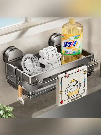 免打孔吸盘置物架,厨房收纳神器! 这款吸盘厨房置物架是您厨房的好帮手!采用超强吸附力的360°旋转吸盘设计,牢固不伤墙面,免打孔安装,轻松解决水槽边空间浪费问题。可挂抹布、沥水、放调料瓶,一物多用,整洁又实用。防水材质耐高温,易清洁不变形,适用于各种台面和水龙头。让您的厨房瞬间清爽有序,提升生活品质,赶紧入手吧!